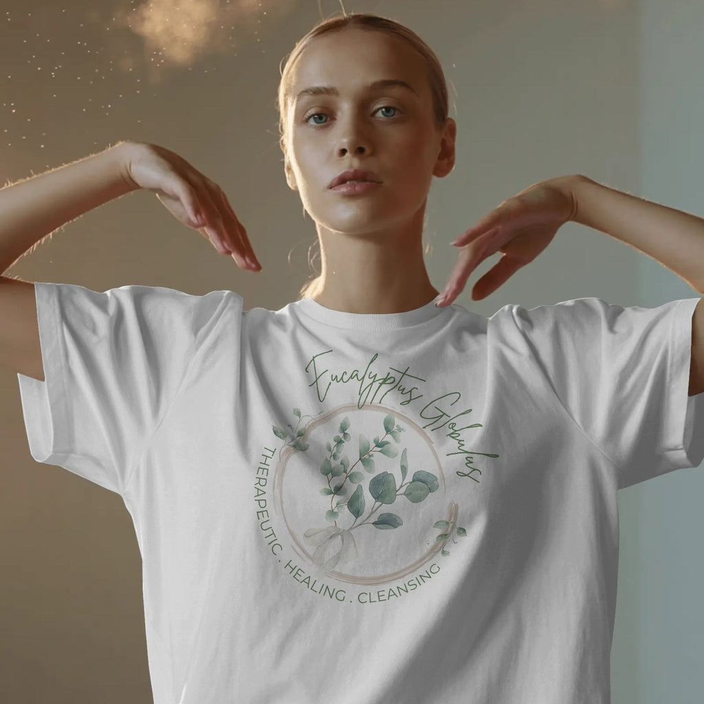 Person wearing a white t-shirt with a nature-themed design and text.