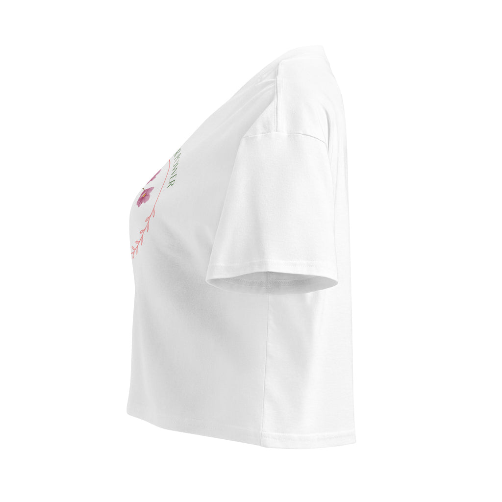 White strapless top with floral embroidery on a white background